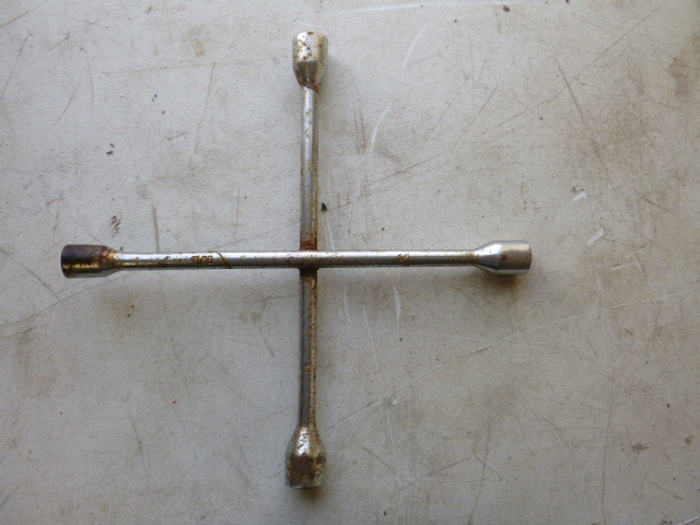 lot 58 image: 4-Way Tire Wrench