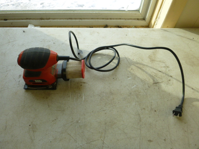 lot 83 image: Black & Decker Palm Sander QS900.