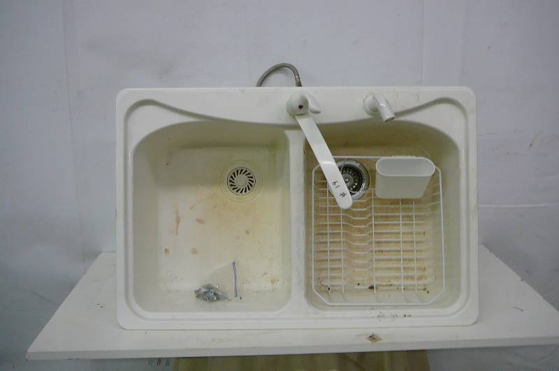 white sink and faucets