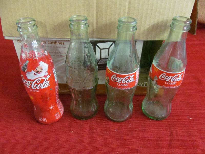 lot 70 image: Coke Cola bottles