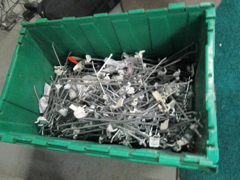 Nice plastic bin of peg hooks...