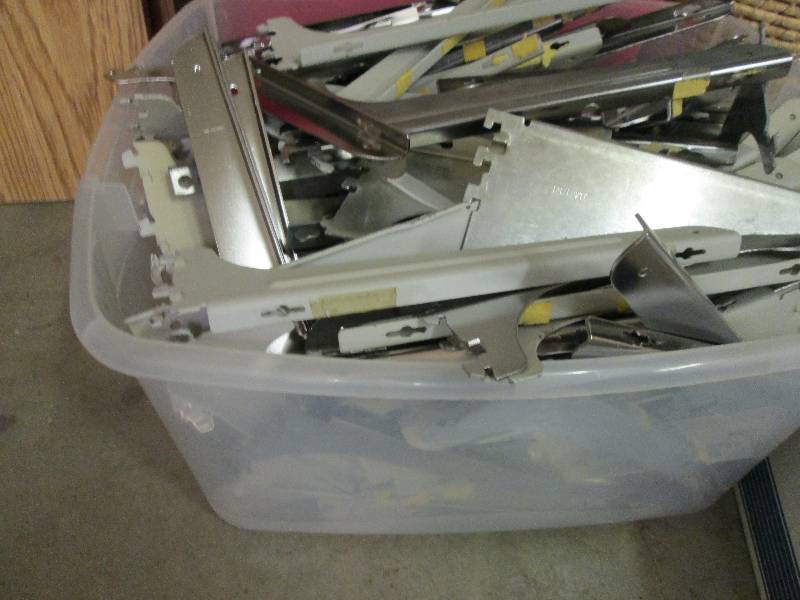 Large plastic tub of shelf brackets...