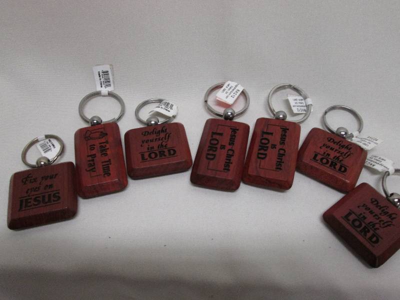 Lot of 7 wooden religious key chain...