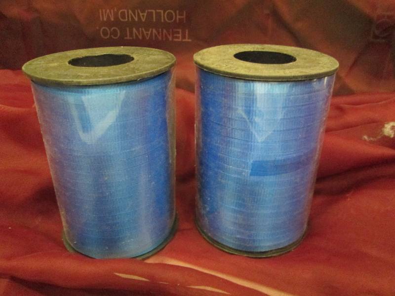 2 rolls blue curling ribbon...