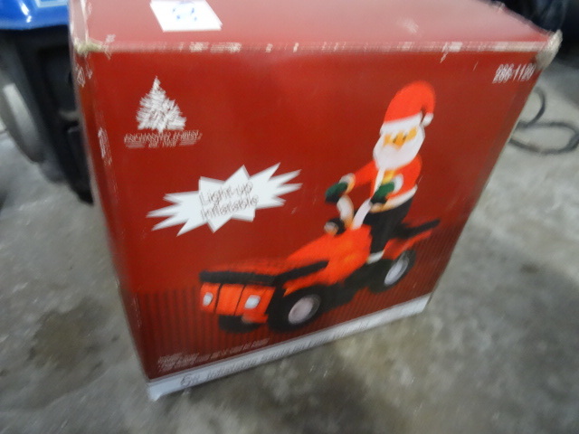 lot 8 image: 6 Inflatable Santa on 2 Wheeler