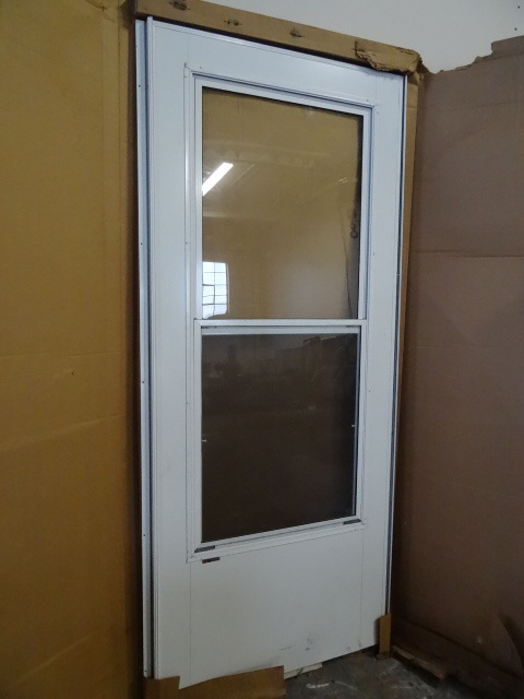 lot 75 image: EZEE Door Solid Core Storm Door