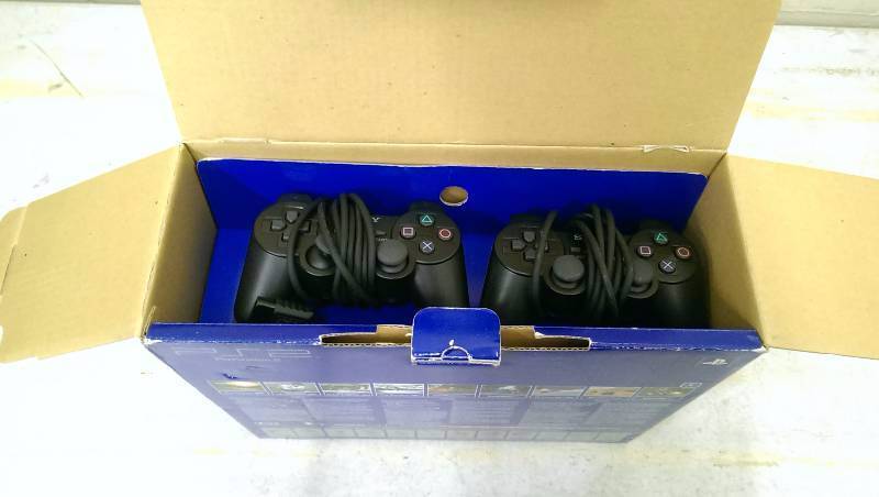 lot 18 image: Sony Playstation 2 Bundle