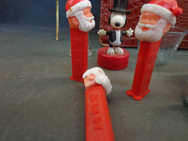 lot 87 image: Santa Peez Dispensers,Glass Dishes, Cross & More