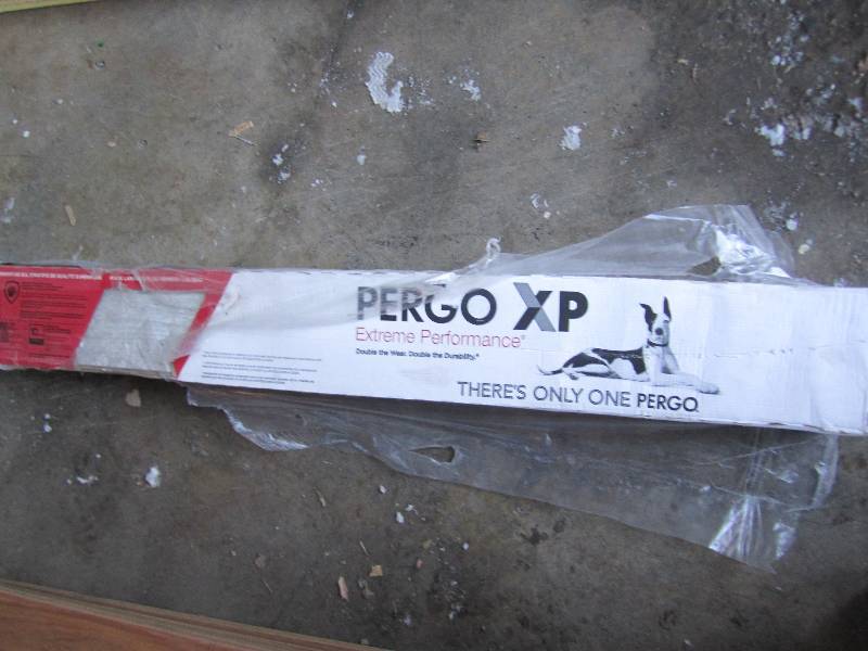 lot 107 image: one case pergo XP coastal pine 8 pl...