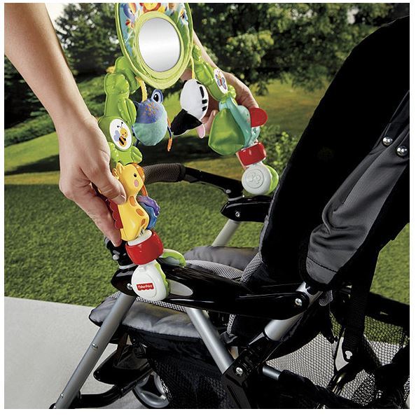 lot 20 image: Fisher Price Deluxe Stroller Activity Center
