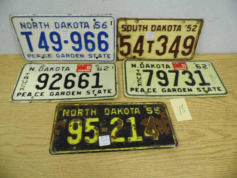 lot 18 image: North Dakota and South Dakota License Plates