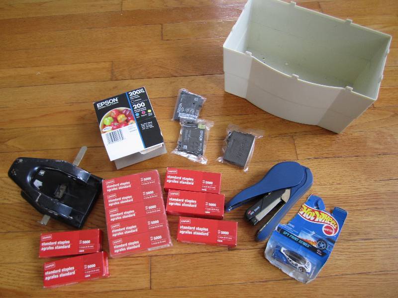 Box of office supplies, lots of sta...