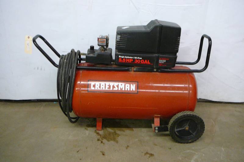 lot 12 image: Air Compressor Single Cylinder Oil Free 5.5 HP 30 gal on wheels with hose Runs and works Slow to get up to Pressure