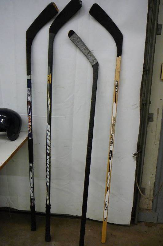 lot 29 image: 4- Hockey Sticks