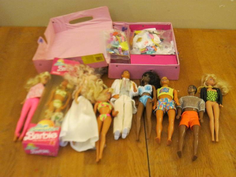 lot 16 image: Lot Of Barbie Dolls And Case