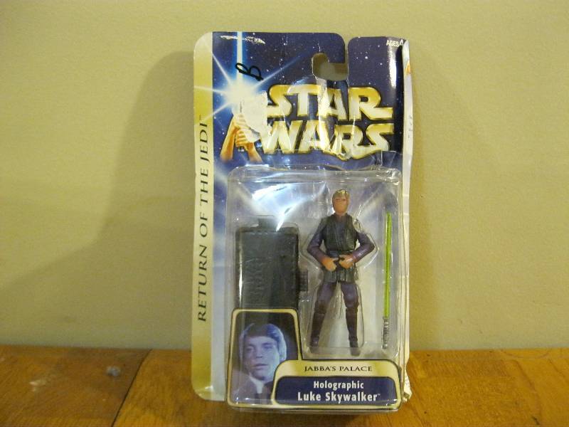 lot 36 image: Star Wars Figure Holographic Luke Skywalker, Some Wear To Package