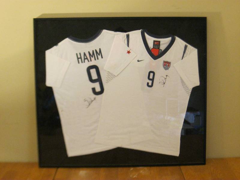 lot 50 image: Framed Signed Autographed Mia Hamm Shirt, See Pics, No COA