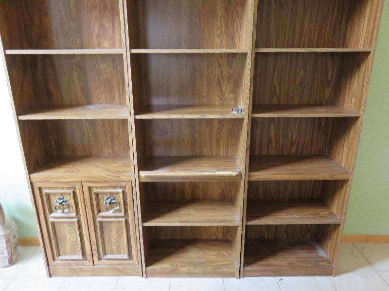 set of three bookshelves