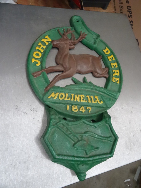 lot 122 image: John Deere Cast Iron Wall Hanging