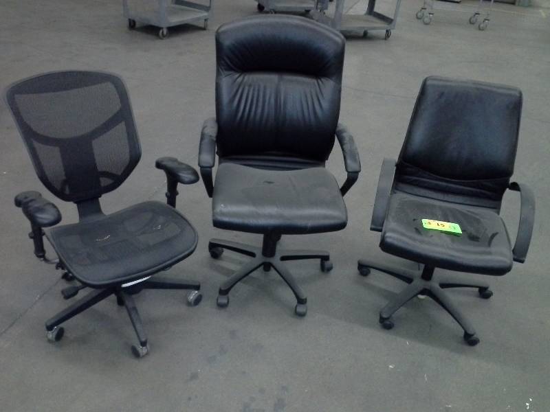 Set of three mismatched office chairs, black