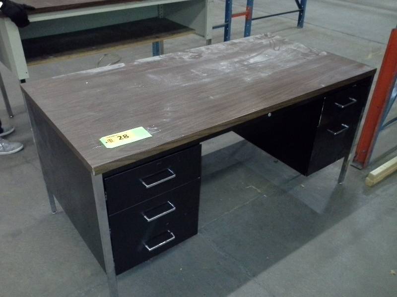 Standard metal desk, wood top.
