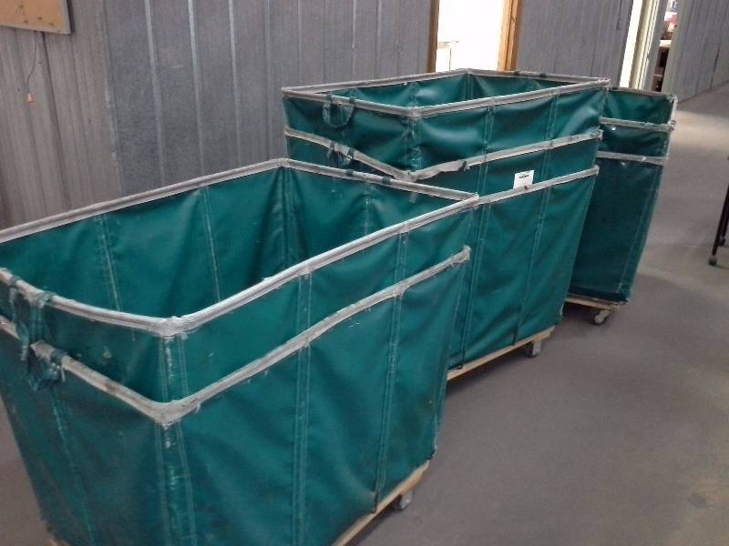 7 green shipping and receiving bins