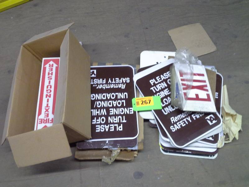 Large assortment of metal and plastic signs
