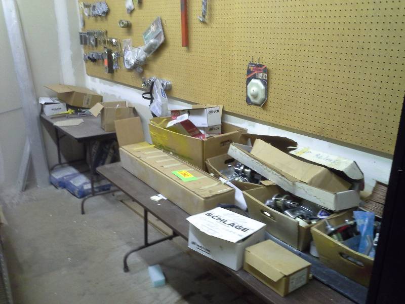 Large quantity of door handles, locks and related items.