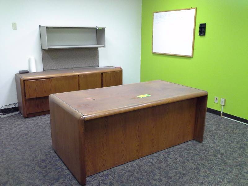 Office desk, credenza, overhead storage and whiteboard