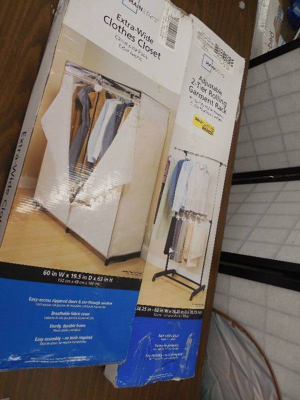 lot 89 image: Mainstays Adjustable 2-Tier Garment Rack & Cover
