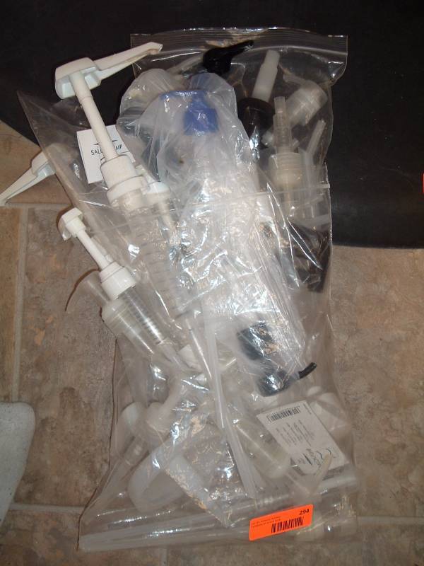 lot 294 image: Bag of Liter and Gallon Pumps