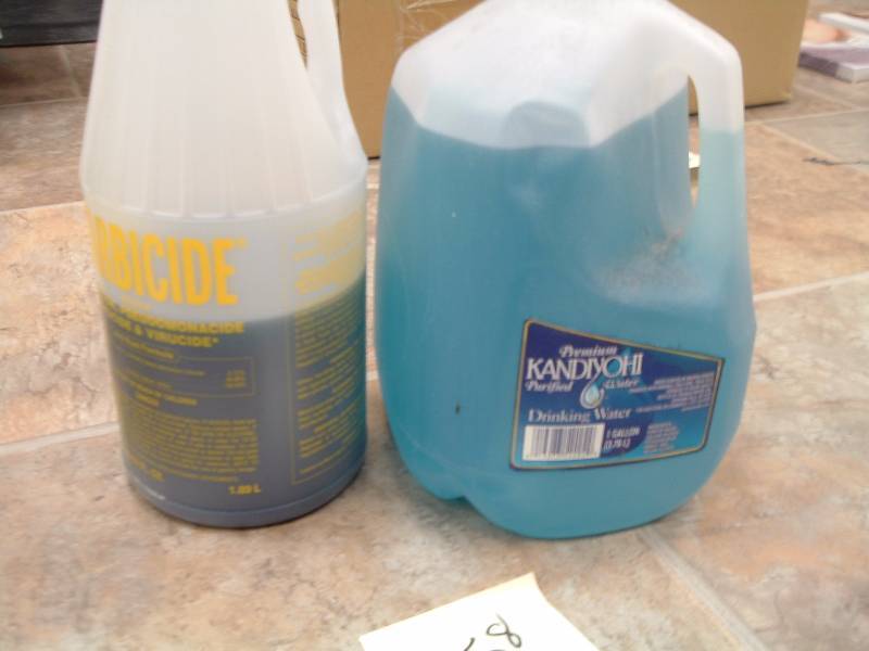 lot 458 image: Barbicide  unmixed and mixed