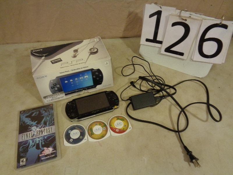 lot 126 image: Sony PSP and 4 Games
