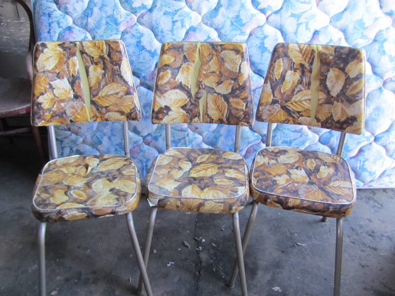 3 vintage chairs with cracked vinal...