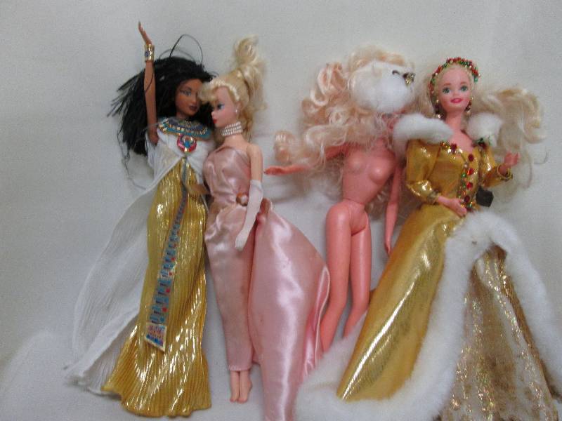 4 out of box Barbies, 1 Holiday & 1...