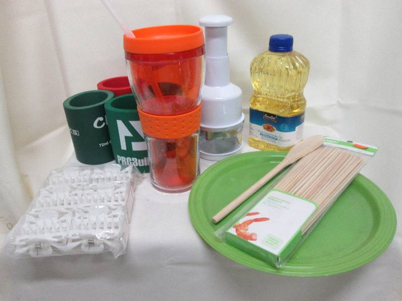 lot 15 image: 4 can coolers, 1 pkg bamboo skewers...