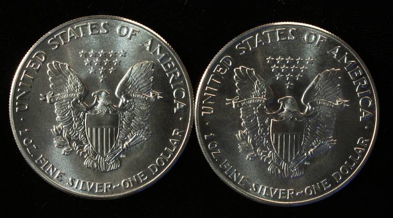 LOT OF 2 1986 AMERICAN SILVER EAGLE DOLLAR COINS 1 TROY OZ. FINE SILVER EACH