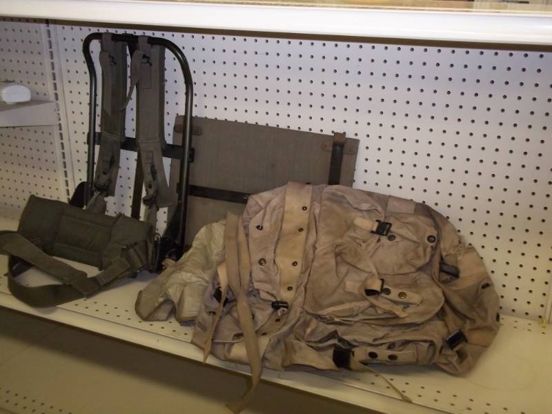 lot 27 image: Backpack frame with backpack and Map case