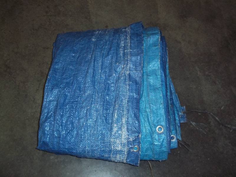 lot 58 image: Tarp may have some holes good for woodpile
