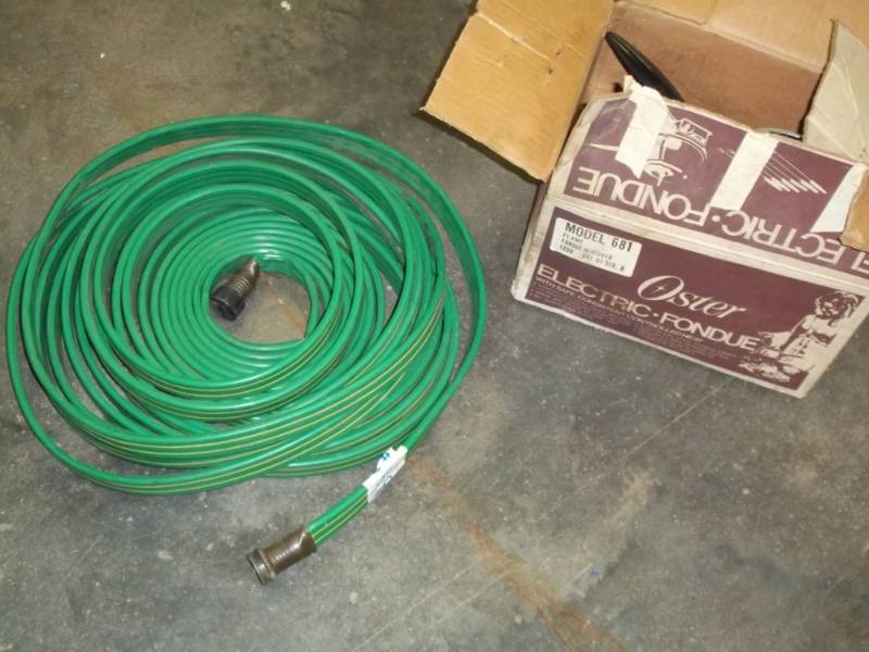lot 92 image: Flat garden hose and oster electric Fondue set