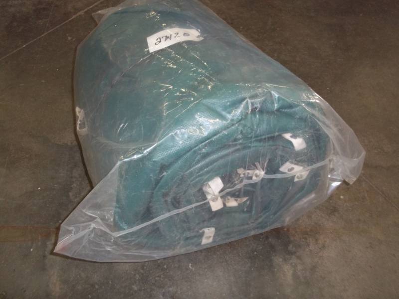 lot 133 image: Tarp may have some holes good for woodpile