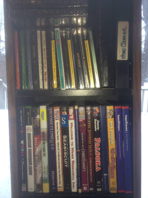 Shelf of dvds and computer cds