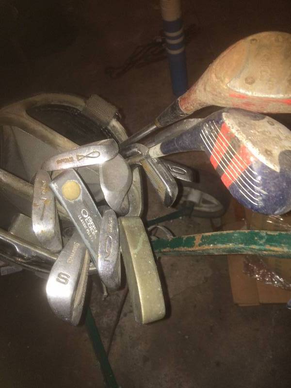 Golf clubs, bag, and cart