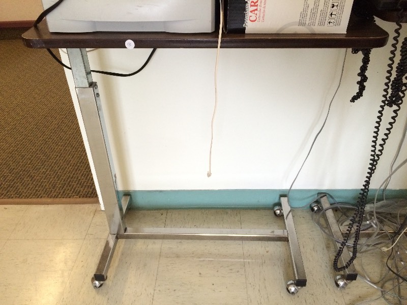 Rolling adjustable table