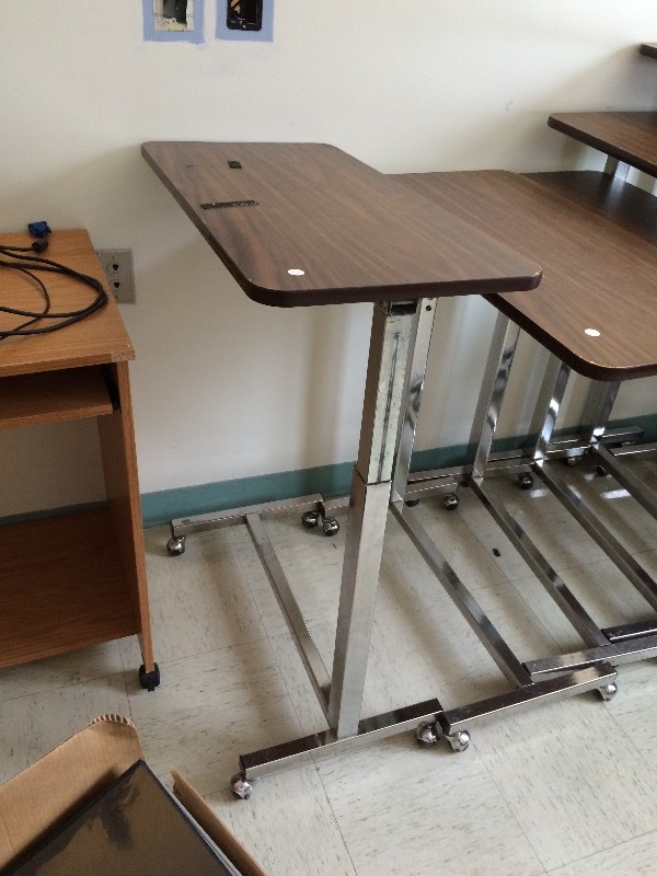 Rolling adjustable table