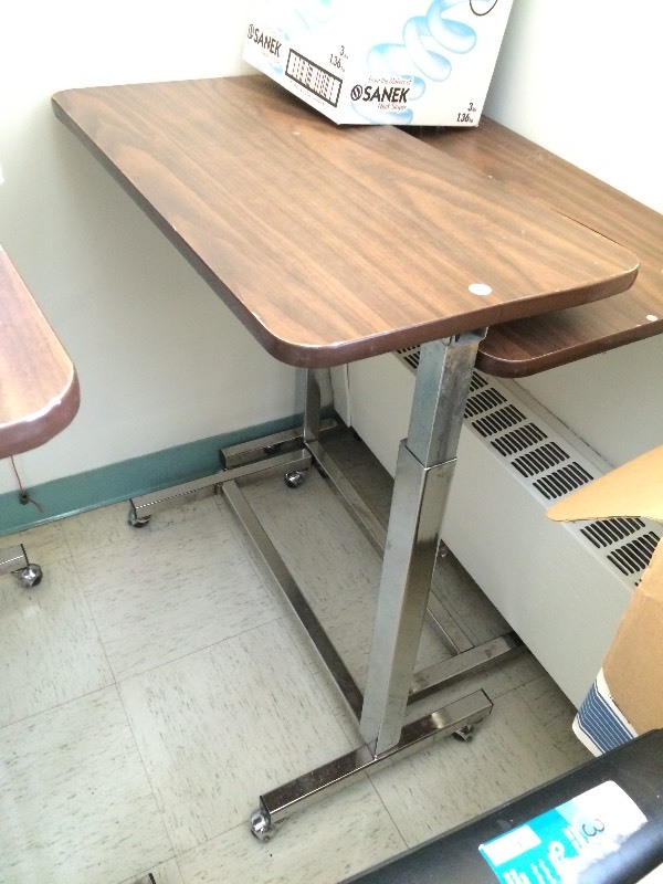 Rolling adjustable table