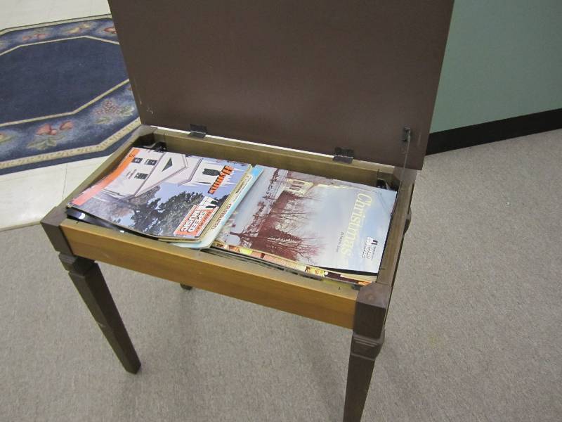 Piano bench filled with music...
