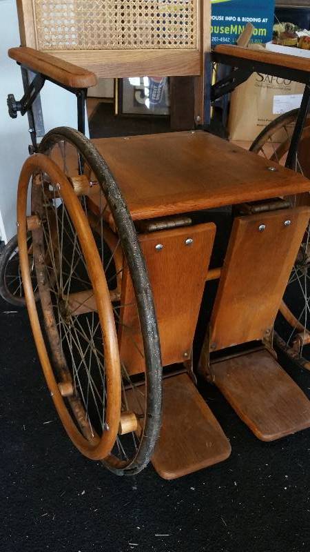 lot 8 image: Antique Cane Backed Wheel Chair