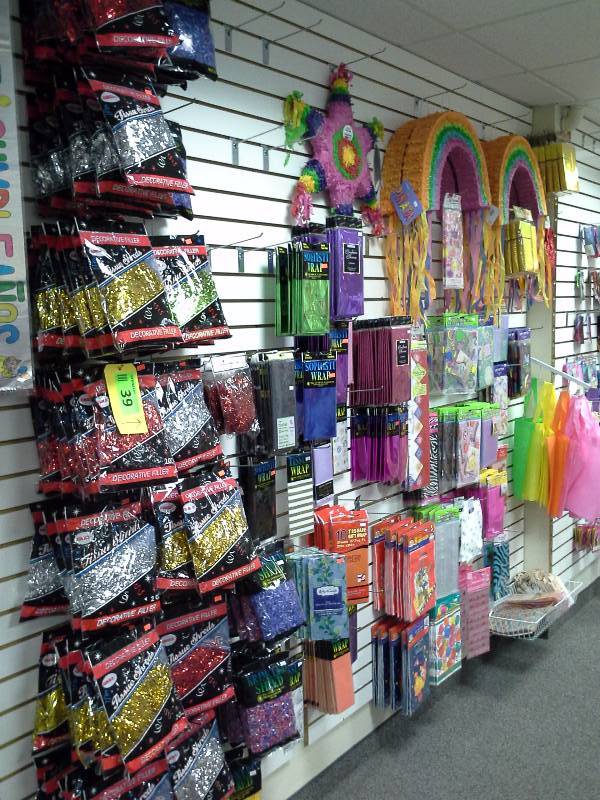 Assortment of party bags, decorative filler, and gift wrap