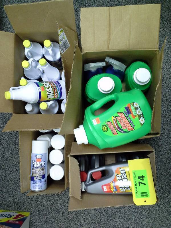 Four boxes of various cleaners, laundry detergent, fabric refresher